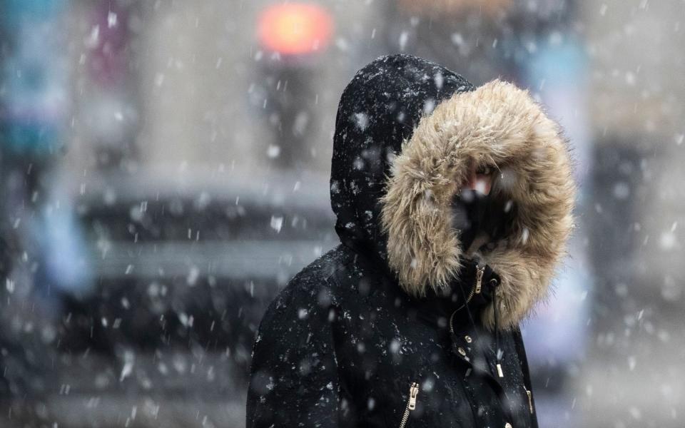 Mandatory Credit: Photo by HAYOUNG JEON/EPA-EFE/Shutterstock (11716468e) A woman wearing a face mask takes a walk in the falling snow in Berlin, Germany, 19 January 2021. German Chancellor Angela Merkel will meet on 19 January afternoon at the chancellery with the federal state premiers to discuss an extension of the current lockdown in an attempt to rein the coronavirus disease (COVID-19) pandemic in the country. Germany discusses to extend coronavirus lockdown, Berlin - 19 Jan 2021 - HAYOUNG JEON/EPA-EFE/Shutterstock