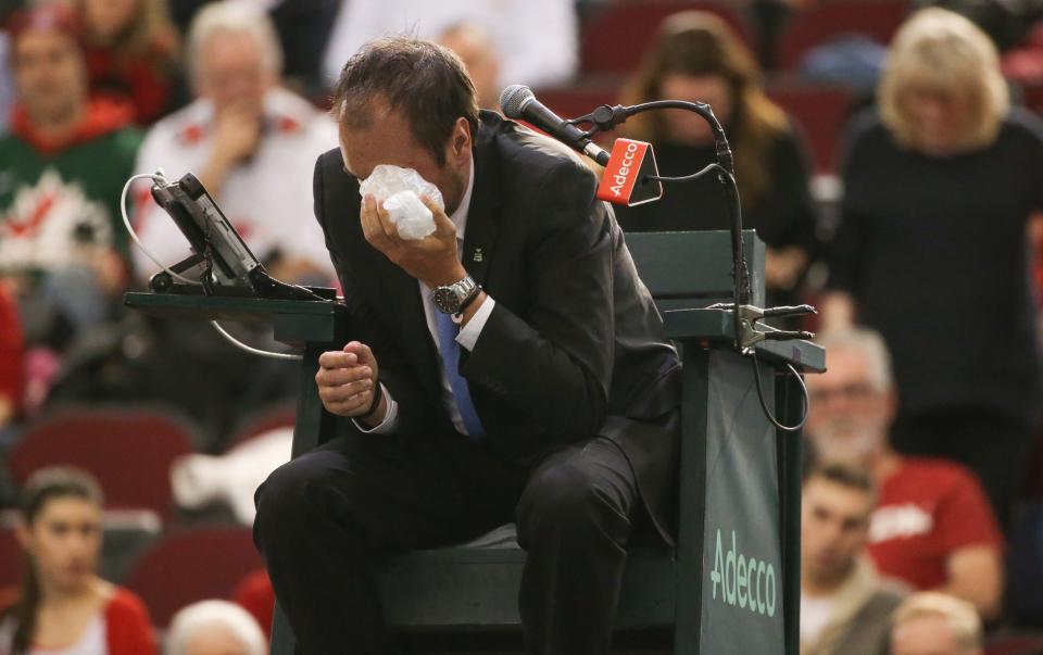 <p>FEBRUARY 5: Chair umpire Arnaud Gabas reacts to getting hit in the eye with a ball hit by Denis Shapovalov of Canada during the singles match between Kyle Edmund of Great Britain on day three of the Davis Cup World Group tie between Great Britain and Canada at TD Place Arena on February 5, 2017 in Ottawa, Ontario, Canada. (Photo by Andre Ringuette/Getty Images for LTA) </p>