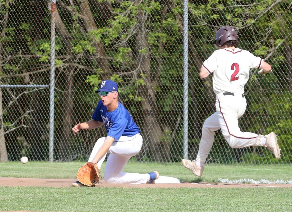 Elmira's Trevor Morrell just beats the throw to first base as Horseheads' Dylan Ribble waits on the ball as the Blue Raiders completed a two-game sweep of Elmira in the Section 4 Class AA baseball championship series with a 13-7 win May 25, 2022 at Ernie Davis Academy.
