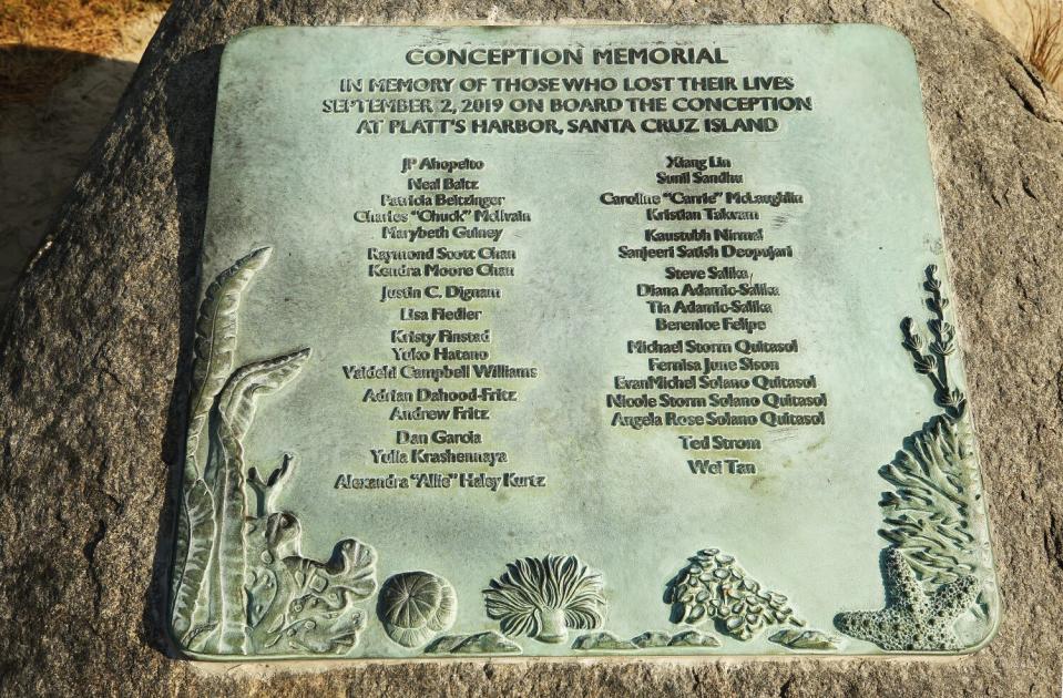 A plaque memorializes the 34 lives lost in the Conception fire.