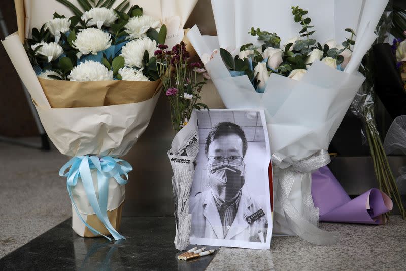 A makeshift memorial for Li Wenliang is seen at an entrance to the Central Hospital of Wuhan