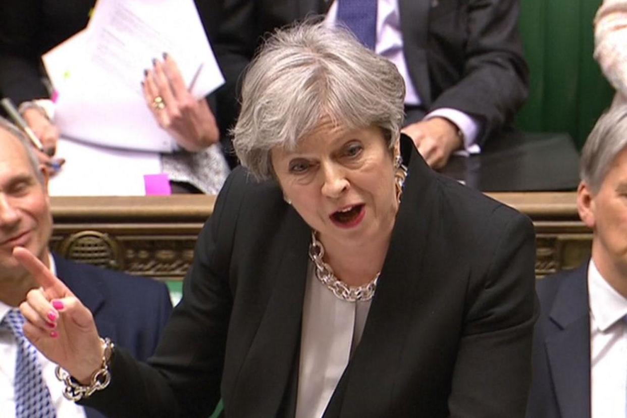 Ambush: Theresa May pictured during PMQs today