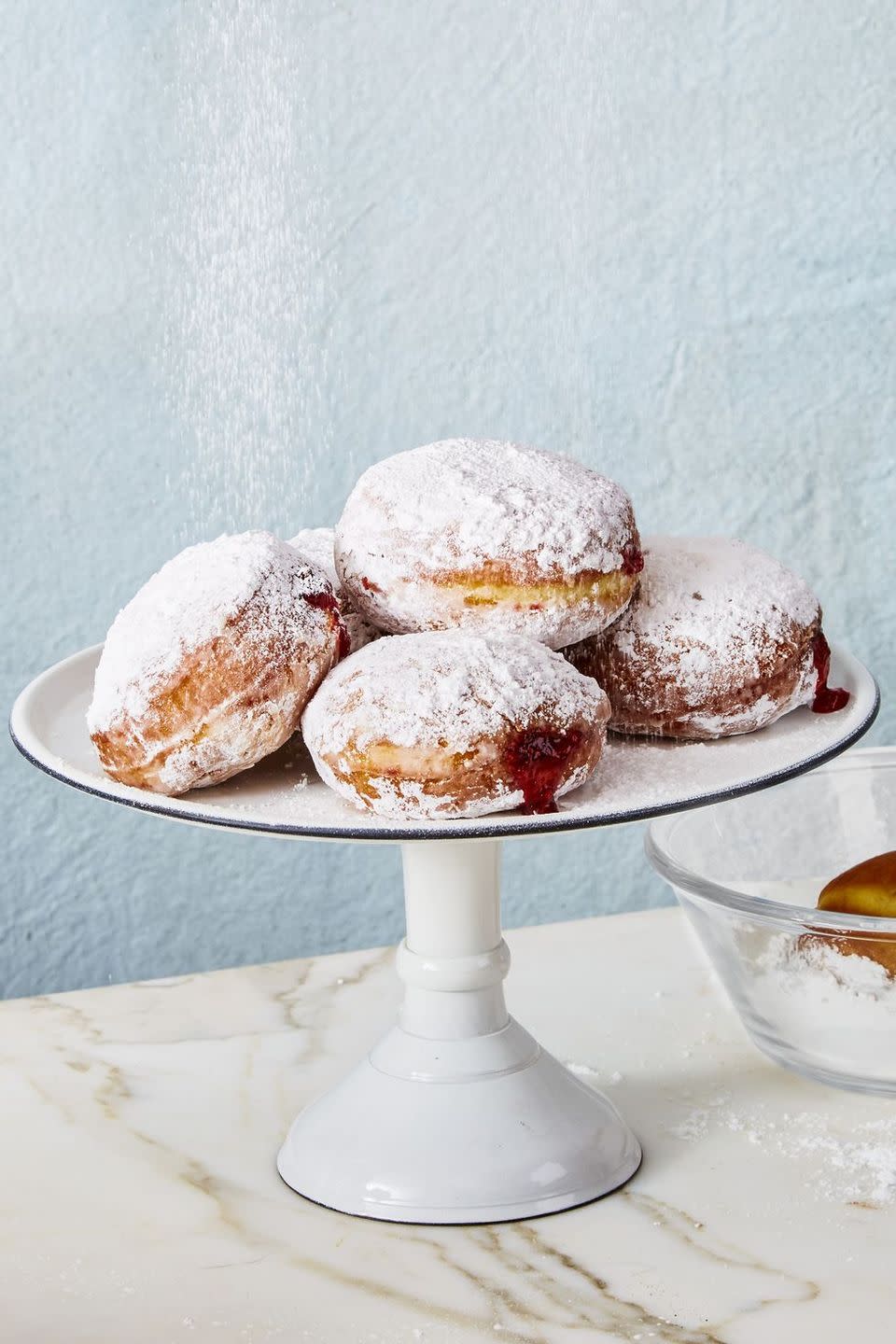 jelly donuts on a cake stand