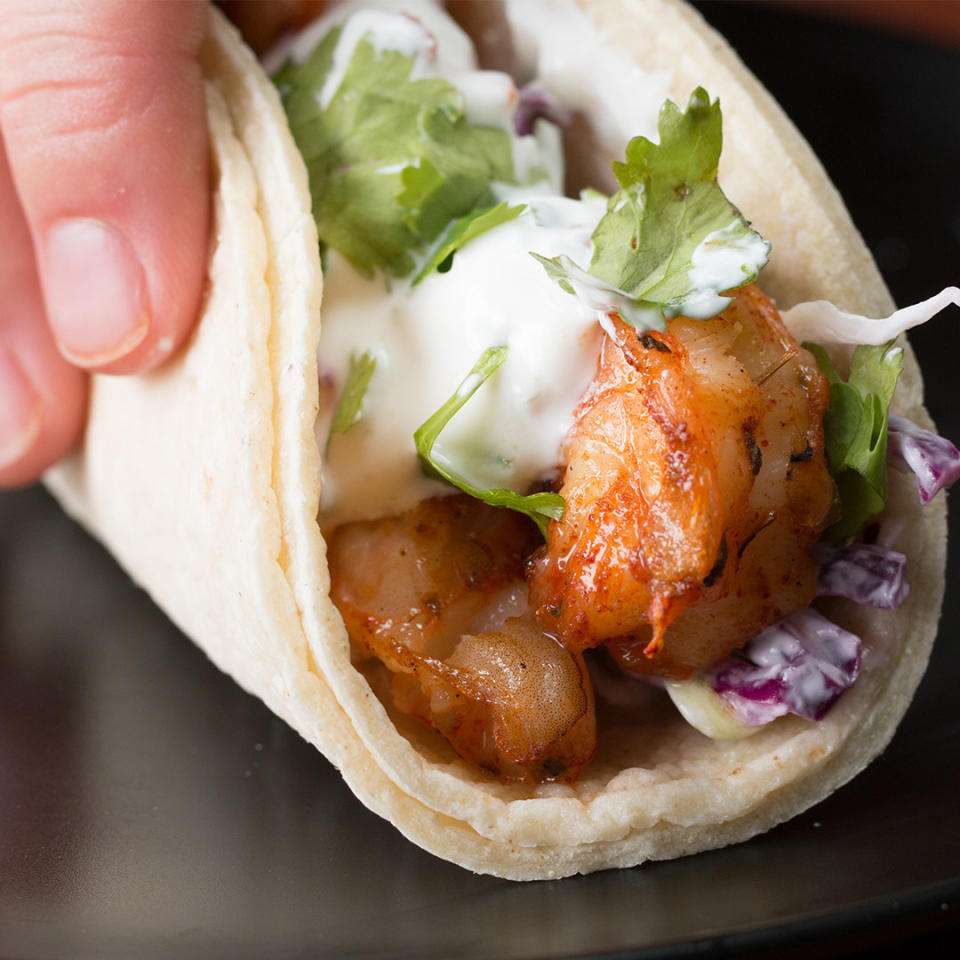 Shrimp taco topped with creamy sauce