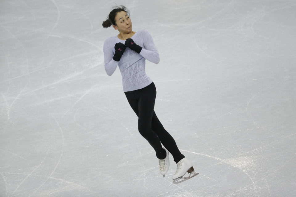 Mao Asada of Japan skates during a practice session at the figure stating practice rink at the 2014 Winter Olympics, Tuesday, Feb. 18, 2014, in Sochi, Russia. (AP Photo/Bernat Armangue)
