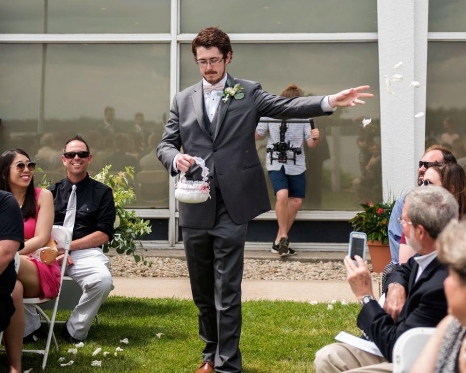 This man served as the flower man in his cousin's wedding. (Credit: Erin Moore Photography)