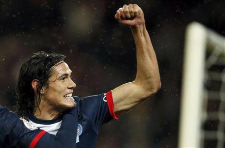 Paris St Germain's Edinson Cavani celebrates after he scored against FC Lorient in their French Ligue 1 soccer match at the Parc des Princes Stadium in Paris November 1, 2013. REUTERS/Benoit Tessier