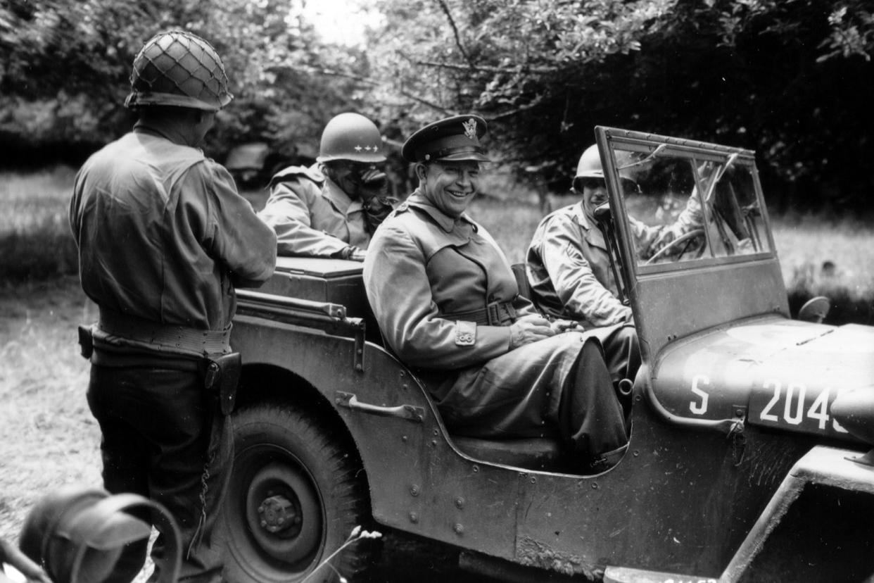 Generals Dwight D. Eisenhower in his jeep in the American sector during the liberation of Lower Normandy in the summer of 1944.
