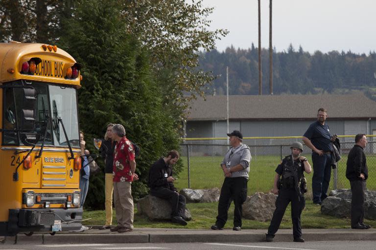 A school bus enters Marysville-Pilchuck High School to evacuate students in the aftermath of a shooting on the school's campus, October 24, 2014 in Marysville, Washington