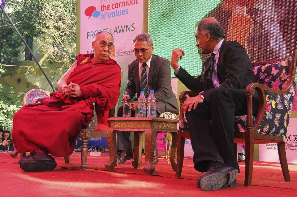 The Dalai Lama, left, listens to one of his biographers, Pico Iyer at one of the sessions on the opening day of India's Jaipur Literature Festival in Jaipur, India, Thursday, Jan. 24, 2013. This year's festival will also feature author Zoe Heller and Booker Prize winner Howard Jacobson. (AP Photo/Deepak Sharma)