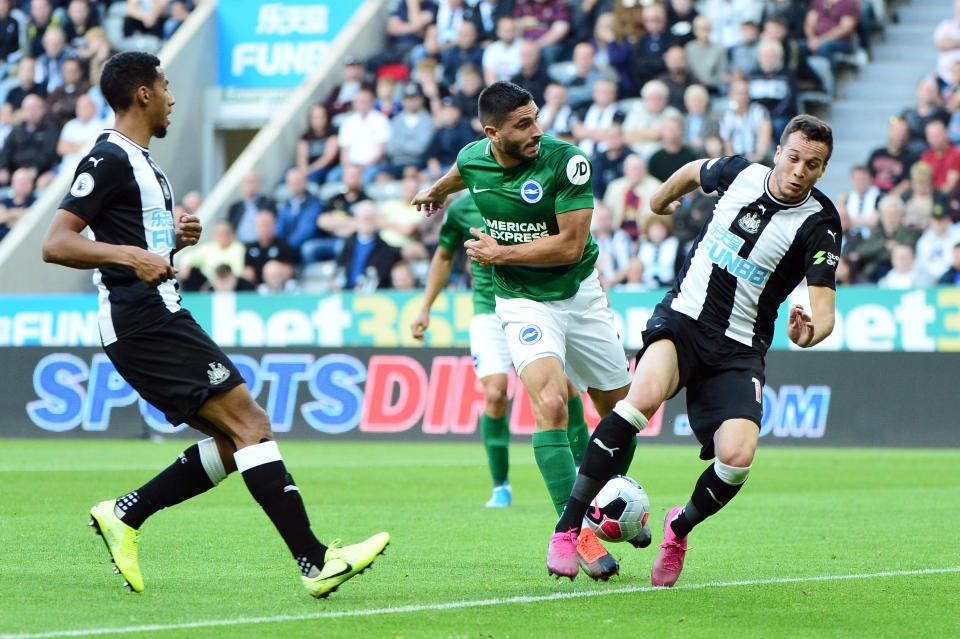 NEWCASTLE UPON TYNE, ENGLAND - SEPTEMBER 21: Neal Maupay of Brighton and Hove Albion shoots at goal challenged by Javier Manquillo of Newcastle United during the Premier League match between Newcastle United and Brighton & Hove Albion at St. James Park on September 21, 2019 in Newcastle upon Tyne, United Kingdom. (Photo by Mark Runnacles/Getty Images)