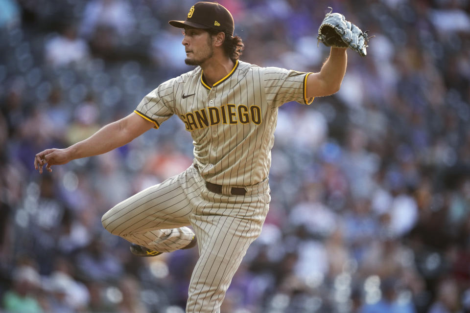 San Diego Padres starting pitcher Yu Darvish watches a throw to a Colorado Rockies batter during the first inning of a baseball game Tuesday, June 15, 2021, in Denver. (AP Photo/David Zalubowski)