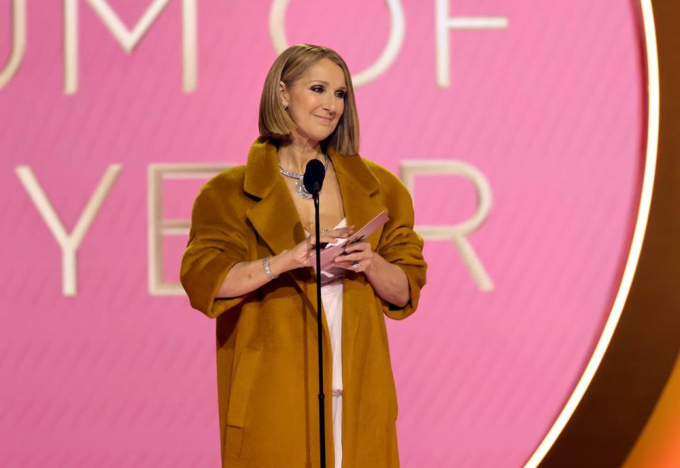 Celine Dion is shown presenting album of the year, a rare public performance by the singer, who has been on hiatus from live performance following her diagnosis with an autoimmune disorder. 