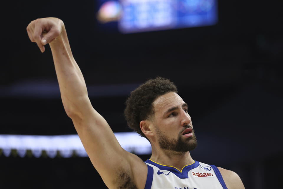 Golden State Warriors guard Klay Thompson reacts after making a three-point basket against the Utah Jazz during the first half of an NBA basketball game in San Francisco, Sunday, April 14, 2024. (AP Photo/Jed Jacobsohn)