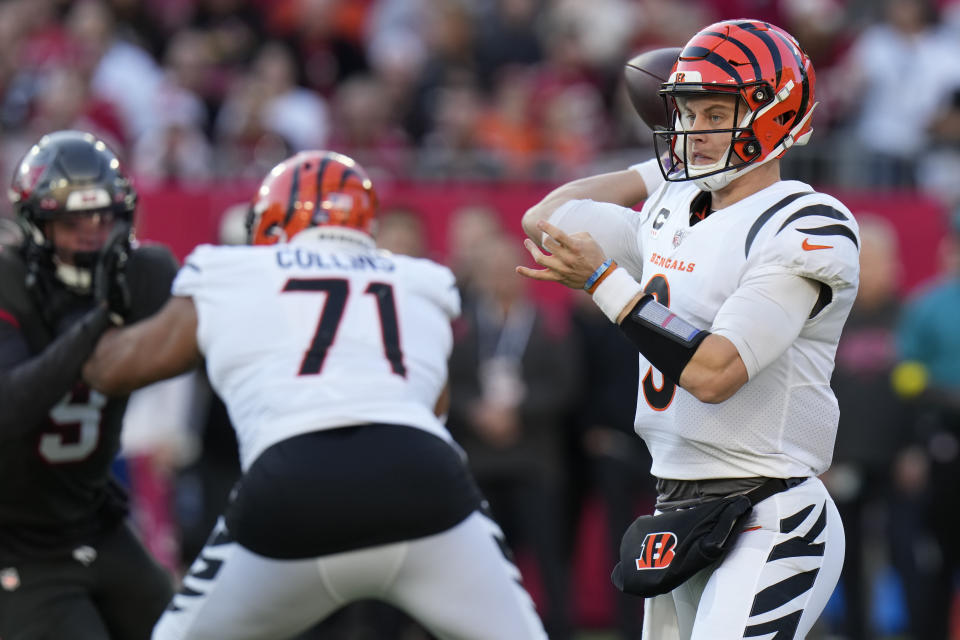 Cincinnati Bengals quarterback Joe Burrow (9) throws a pass against the Tampa Bay Buccaneers during the first half of an NFL football game, Sunday, Dec. 18, 2022, in Tampa, Fla. (AP Photo/Chris O'Meara)