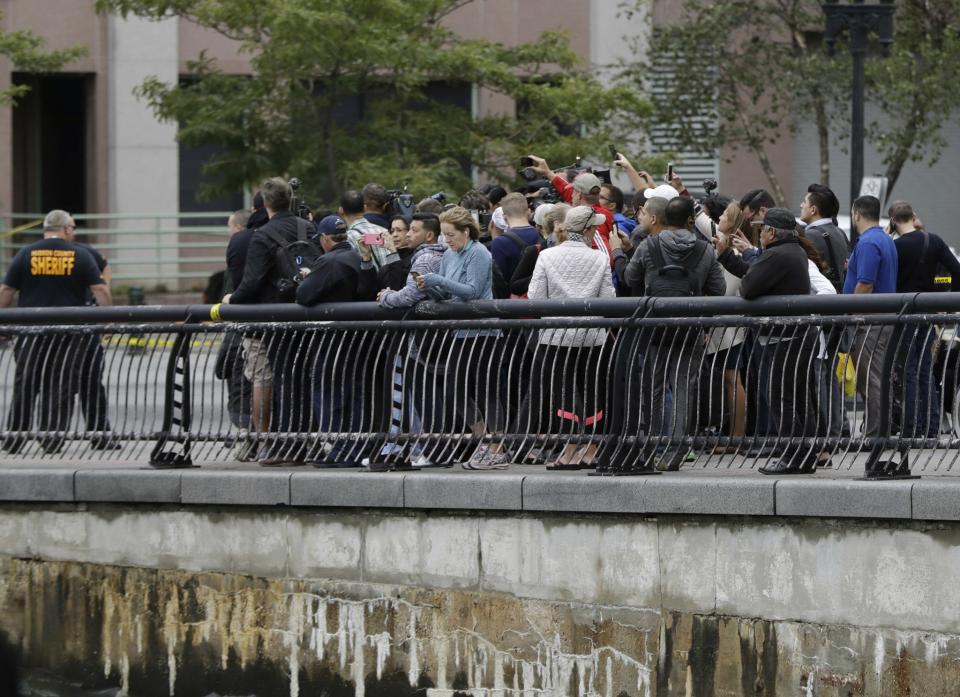 <p>Onlookers gather near the Hoboken Terminal following a train crash, Thursday, Sept. 29, 2016, in Hoboken, N.J. (AP Photo/Julio Cortez) </p>