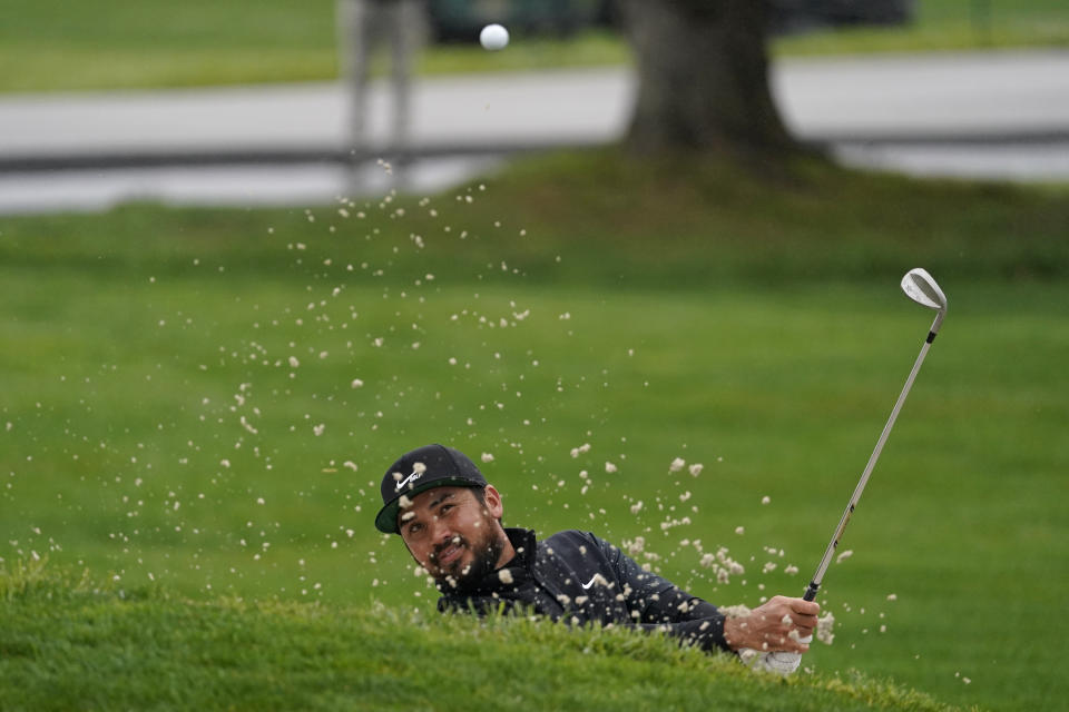 Jason Day, of Australia, follows his shot out of a bunker onto the second green of the Pebble Beach Golf Links during the third round of the AT&T Pebble Beach Pro-Am golf tournament Saturday, Feb. 13, 2021, in Pebble Beach, Calif. (AP Photo/Eric Risberg)