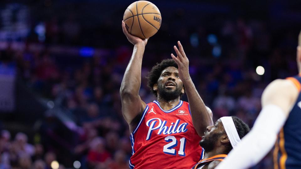 Apr 28, 2024; Philadelphia, Pennsylvania, USA; Philadelphia 76ers center Joel Embiid (21) drives for a shot against New York Knicks forward Precious Achiuwa (5) during the first half of game four of the first round in the 2024 NBA playoffs at Wells Fargo Center. Mandatory Credit: Bill Streicher-USA TODAY Sports