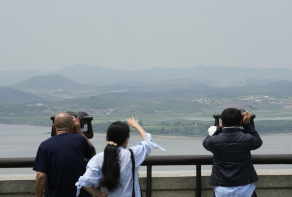 Visitors watch the North Korea side from the Unification Observation Post in Paju, South Korea, near the border with North Korea, Wednesday, May 31, 2023. North Korea's attempt to put the country's first spy satellite into space failed Wednesday in a setback to leader Kim Jong Un's push to boost his military capabilities as tensions with the United States and South Korea rise. (AP Photo/Ahn Young-joon)