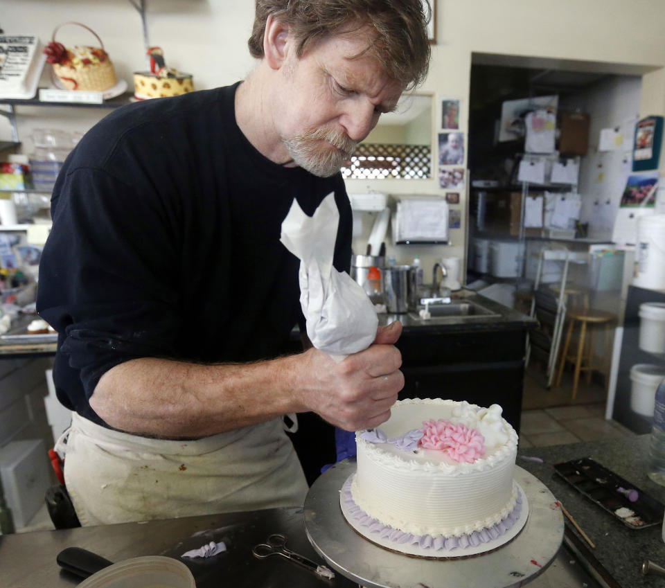 Image: Masterpiece Cakeshop owner Jack Phillips decorates a cake inside his store in Lakewood, Colo., on March 10, 2014. (Brennan Linsley / AP file)