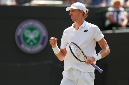 Tennis - Wimbledon - All England Lawn Tennis and Croquet Club, London, Britain - July 11, 2018. South Africa's Kevin Anderson reacts during his quarter final match against Switzerland's Roger Federer. REUTERS/Andrew Boyers