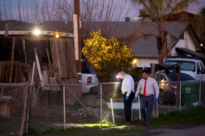 GOSHEN, CA - JANUARY 17, 2023 - - Federal agents continue their investigation at the scene of a shooting that killed six people in Goshen, Calif., on January 17, 2023. Local officials have called the slayings a targeted attack. (Genaro Molina / Los Angeles Times)