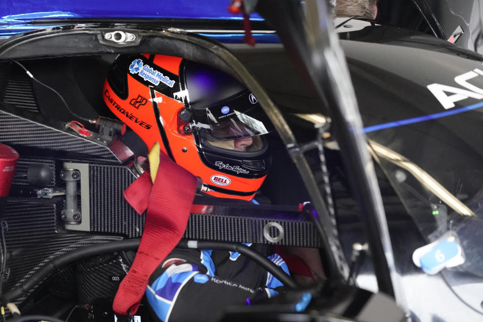 Helio Castroneves prepares to go out on the track for a practice session for the Rolex 24 hour auto race at Daytona International Speedway, Saturday, Jan. 23, 2021, in Daytona Beach, Fla. (AP Photo/John Raoux)