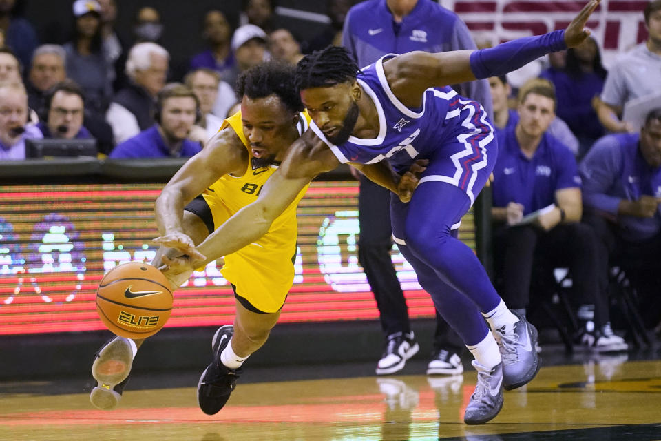 TCU guard Mike Miles Jr., right, and Baylor guard LJ Cryer chase the ball during the first half of an NCAA college basketball game in Waco, Texas, Wednesday, Jan. 4, 2023. (AP Photo/LM Otero)