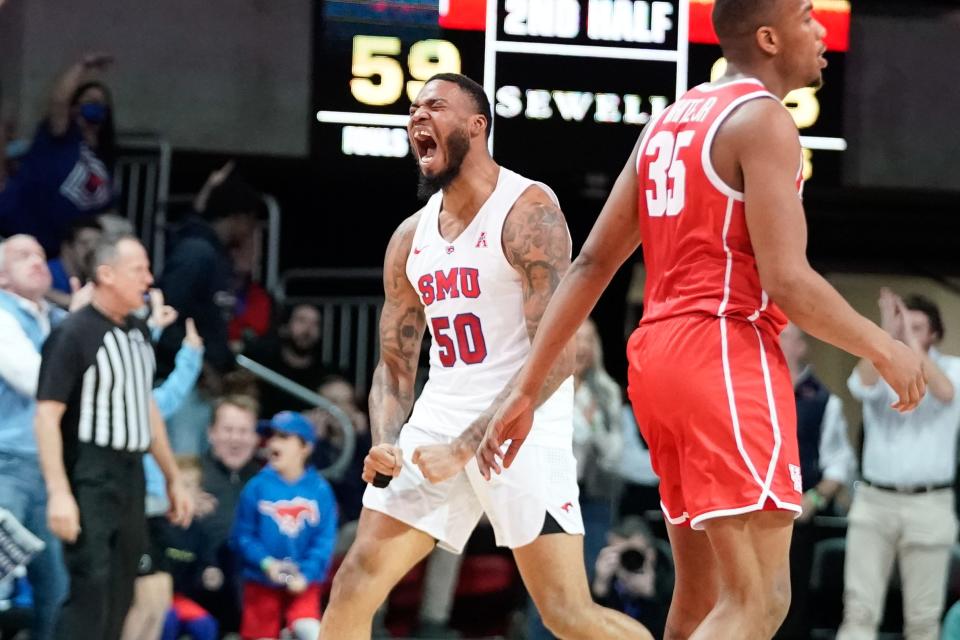 Southern Methodist Mustangs forward Marcus Weathers (50) reacts after making a three point shot against the Houston Cougars during the second half at Moody Coliseum.