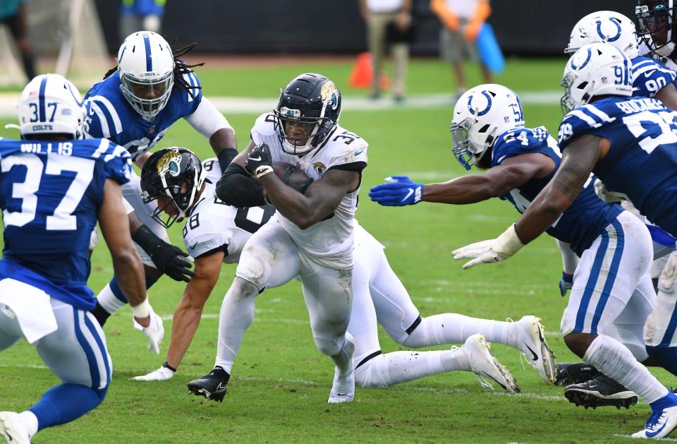 Jacksonville Jaguars running back James Robinson (30) runs for short yardage during late second quarter action. The half ended with the Colts with a 17 to 14 lead over the Jaguars. The Jacksonville Jaguars hosted the Indianapolis Colts for the season opening game at TIAA Bank Field Sunday, September 13, 2020. [Bob Self/Florida Times-Union]