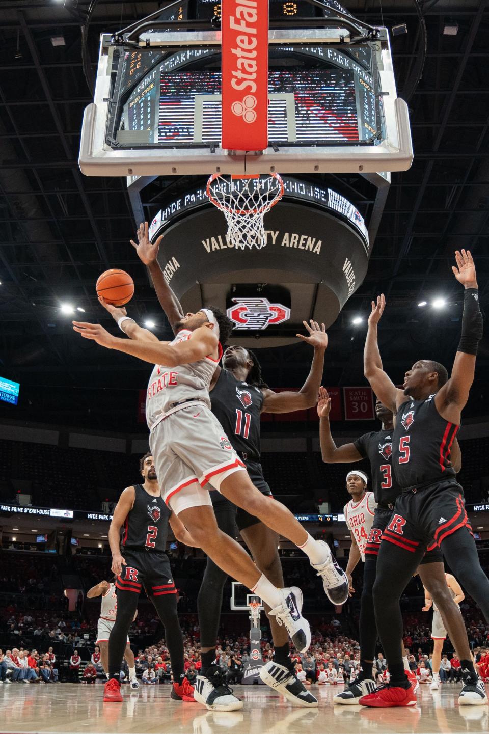 Jan 3, 2024; Columbus, OH, USA;
Ohio State Buckeyes guard Roddy Gayle Jr. (1) goes for a layup against Rutgers Scarlet Knights center Clifford Omoruyi (11) during their game on Wednesday, Jan. 3, 2024 at Value City Arena.