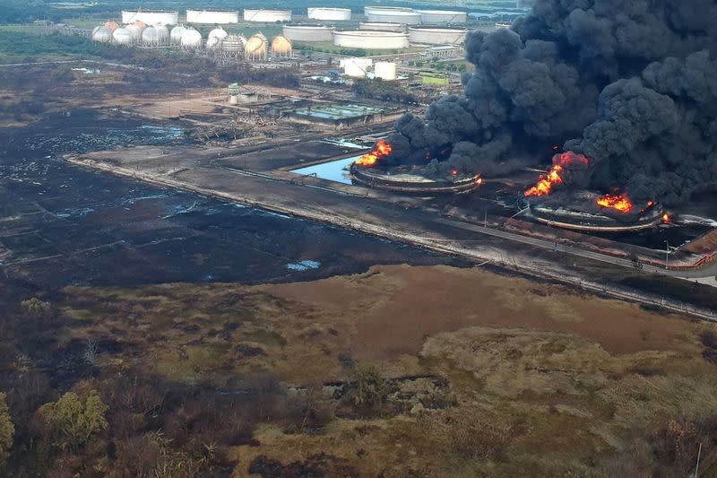 An aerial picture shows smoke rising during fire at Pertamina's oil refinery in Balongan