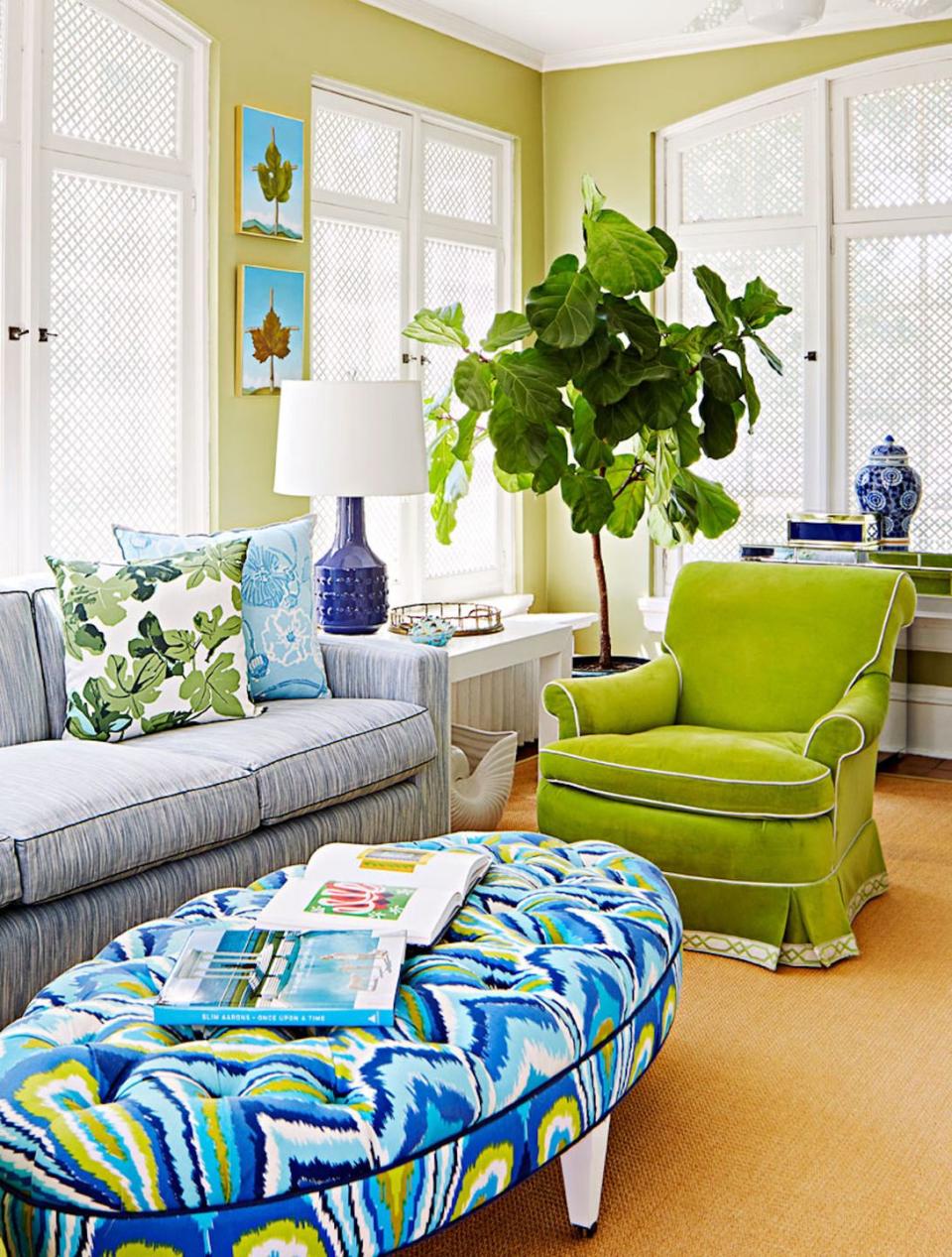 <p>A colorful ottoman decorates this living area from <a href="https://deringhall.com/interior-designers/amanda-reynal-interiors" rel="nofollow noopener" target="_blank" data-ylk="slk:Amanda Reynal Interiors;elm:context_link;itc:0;sec:content-canvas" class="link ">Amanda Reynal Interiors</a>.</p>