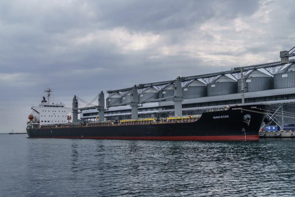 FILE - The ship Navi-Star sits full of grain since Russia's invasion of Ukraine began five months ago as it waits to sail from the Odesa Sea Port, in Odesa, Ukraine, July 29, 2022. U.S. President Joe Biden has warned that global hunger could increase because of Russia’s suspension of a U.N.-brokered deal to allow safe passage for ships carrying Ukrainian grain. (AP Photo/David Goldman, File)