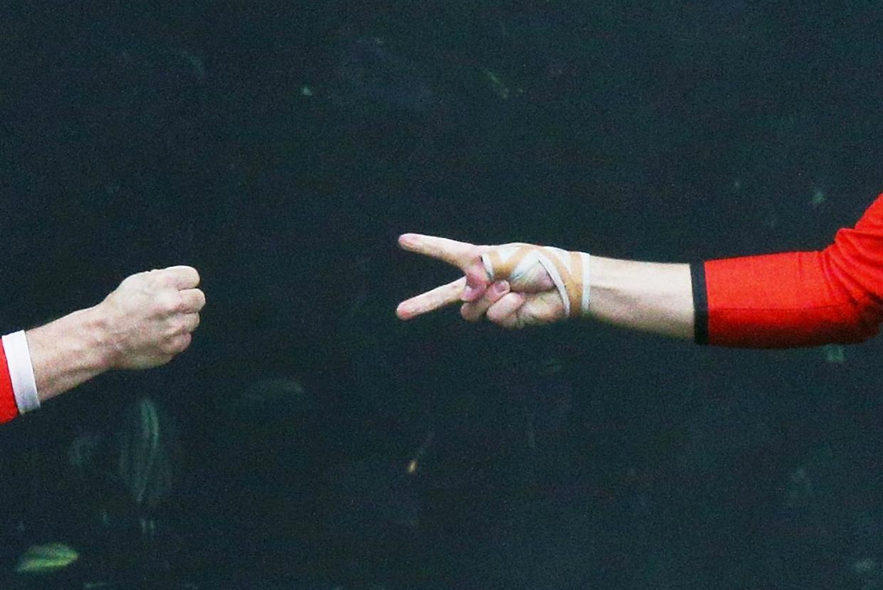 Two Australian Football League players play 'rock, paper, scissors' earlier this year: Getty Images