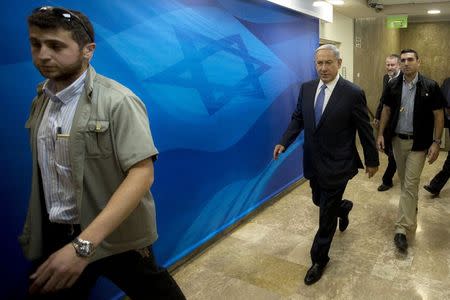 Israel's Prime Minister Benjamin Netanyahu (C) arrives to a cabinet meeting at his office in Jerusalem June 7, 2015. REUTERS/Sebastian Scheiner/ Pool