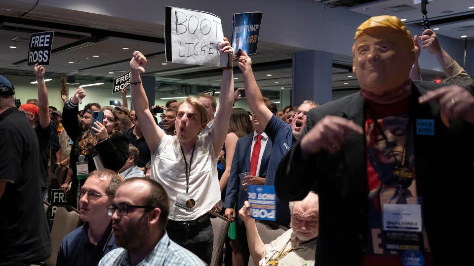 Attendees jeer Trump as he speaks at the Libertarian convention on May 25, 2024. - Jose Luis Magana/AP