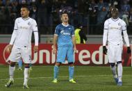 Zenit St Petersburg's Aleksandr Kerzhakov (C) reacts as Porto's Eliaquim Mangala (R) and Nicolas Otamendi stand nearby during their Champions League soccer match at the Petrovsky stadium in St. Petersburg November 6, 2013. REUTERS/Alexander Demianchuk (RUSSIA - Tags: SPORT SOCCER)