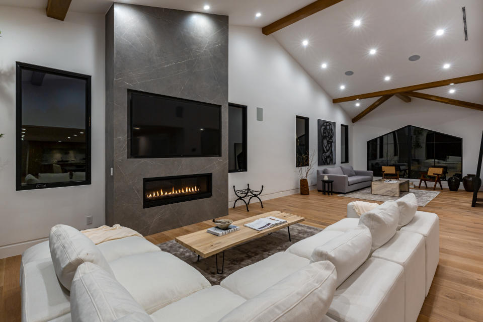 Recessed fireplaces and televisions add to the minimalist look. (The Agency)
