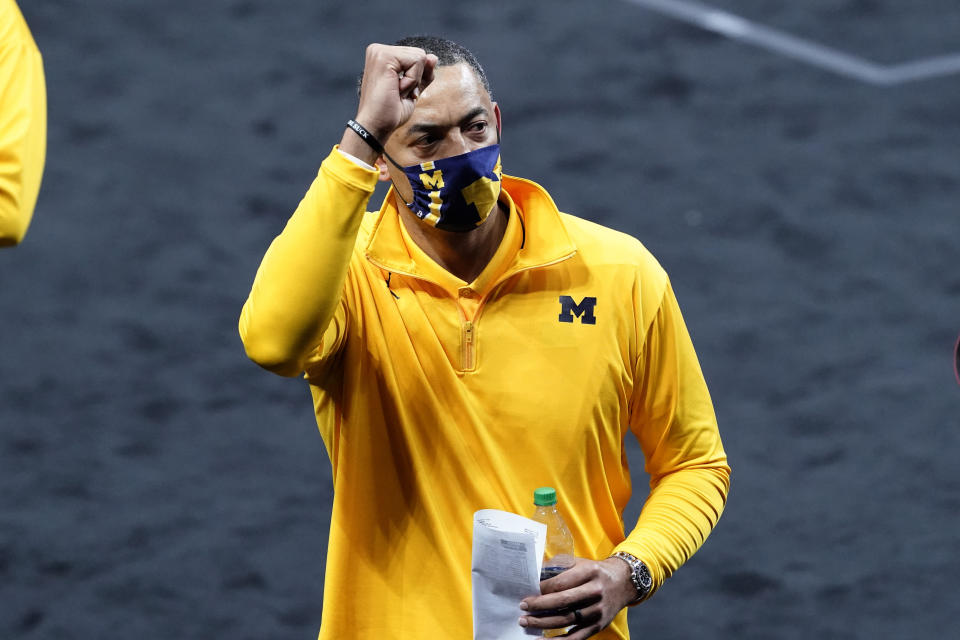 Michigan head coach Juwan Howard celebrates as he walks off the court after a second-round game against LSU in the NCAA men's college basketball tournament at Lucas Oil Stadium Monday, March 22, 2021, in Indianapolis. Michigan won 86-78. (AP Photo/AJ Mast)