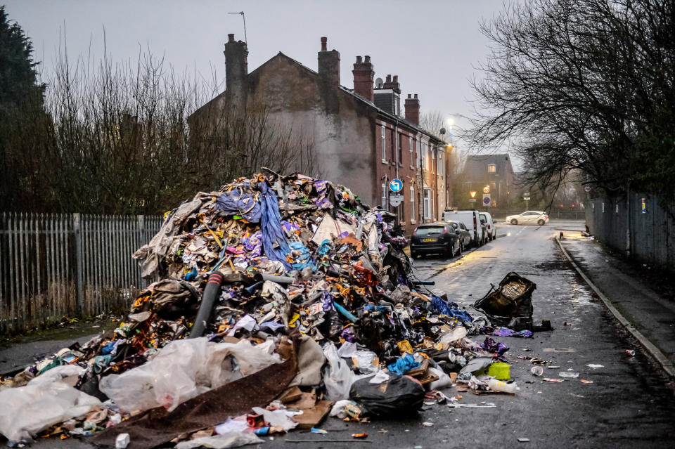 The huge pile of rubbish was dumped overnight, leaving the road impassable. (SWNS)