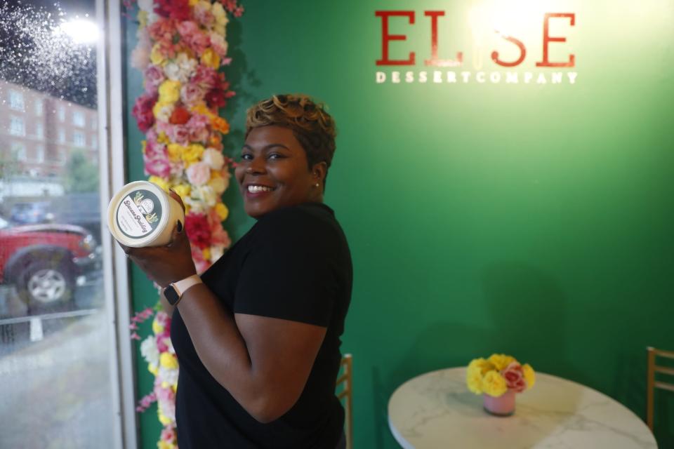 Owner Bria Woods holds up a container of banana pudding inside Elise Dessert Co., which opened July 1 at 3536 Walker Ave. in East Memphis. Elise Dessert Co. is most well known for its banana puddings and other sweet treats.