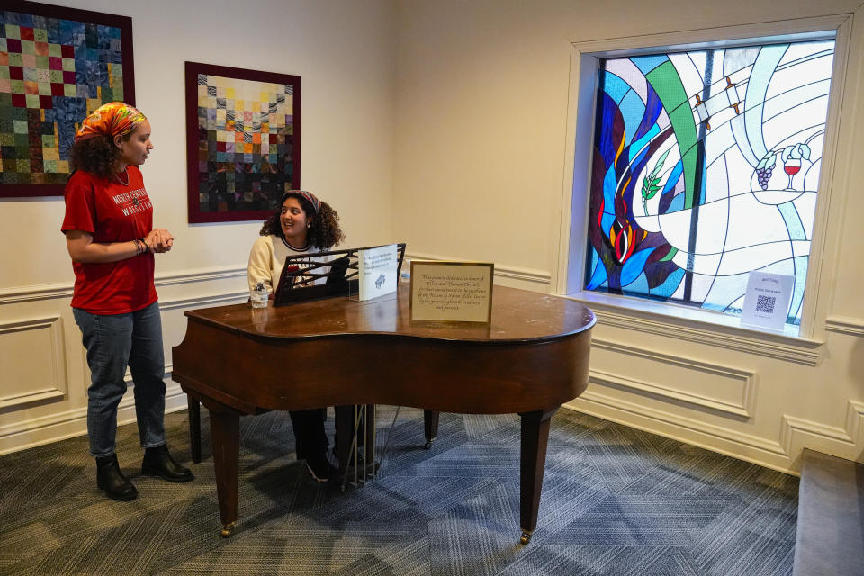 Hillary Haine, left, sings with Kim Gabriel at the Helene G. Simon Hillel Center at Indiana University in Bloomington, Ind., Tuesday, Feb. 13, 2024.An Indiana bill to address antisemitism on college campuses lost support from some members of the Jewish community after an amendment altered language surrounding criticism of Israel. (AP Photo/Michael Conroy)