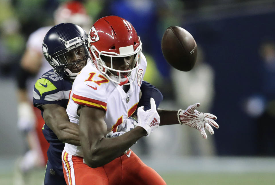 Chris Conley of the Chiefs loses a fumble in the first half of a loss to the Seahawks. (AP)