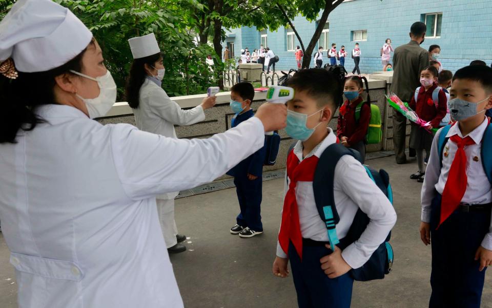 North Korea has yet to report a case of Covid-19, but it has not been immune from the economic impacts brought about by the global response to the virus - Jon Chol Jin /AP