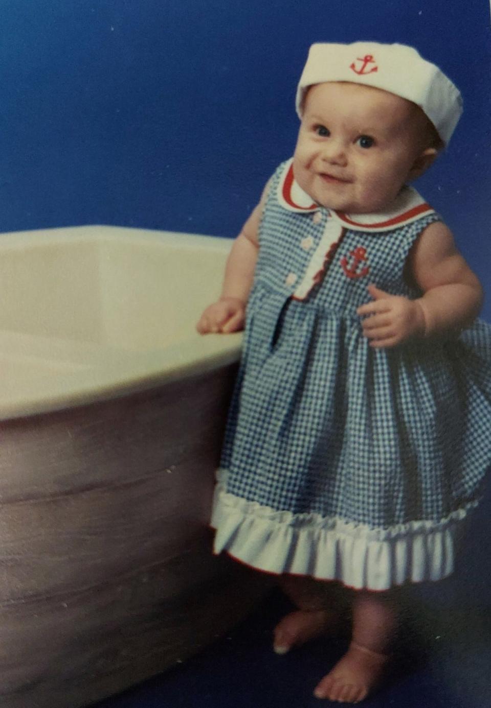 A photo of Sophia Odom in 2006 in a sailor's outfit.