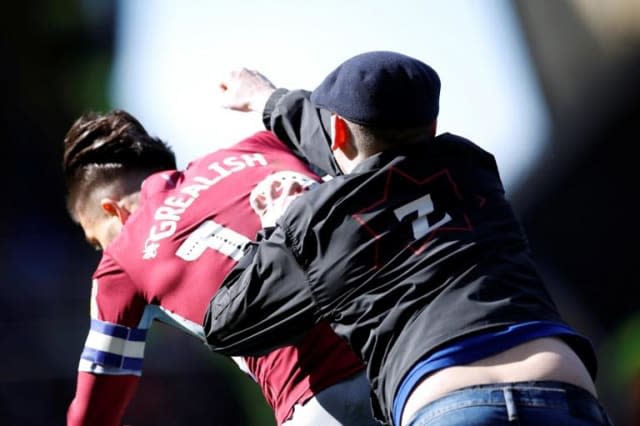 Jack Grealish punched: Aston Villa midfielder hit by fan on pitch during derby with Birmingham City