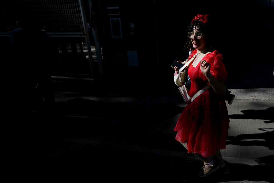 A fan makes her way to the Monumental stadium to attend Taylor Swift: The Eras Tour concert, in Buenos Aires, Argentina, Thursday, Nov. 9, 2023. (AP Photo/Natacha Pisarenko)