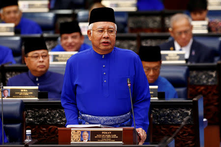 Malaysia's Prime Minister Najib Razak presents the 2018 budget at the parliament house in Kuala Lumpur, Malaysia October 27, 2017. REUTERS/Lai Seng Sin/Files