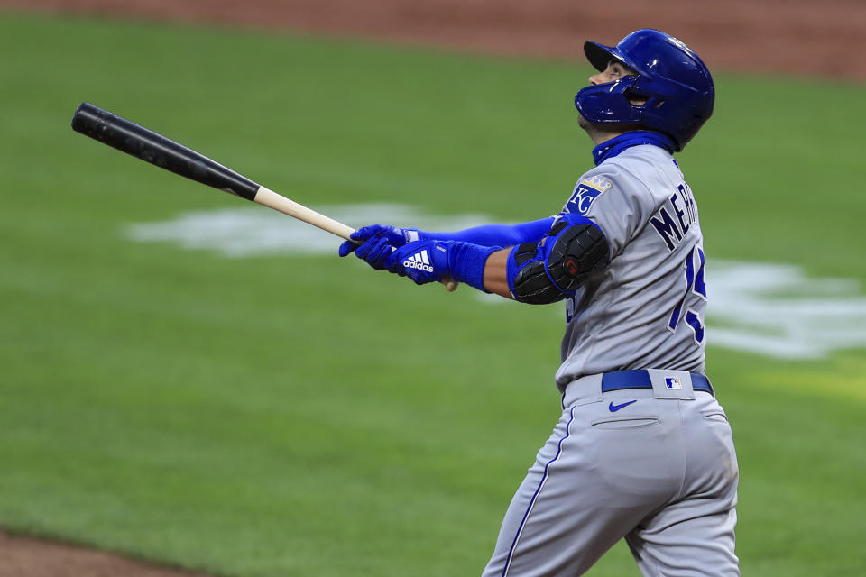 Kansas City Royals' Whit Merrifield (15) hits a sacrifice fly in the fourth inning during a baseball game against the Cincinnati Reds in Cincinnati, Wednesday, Aug. 12, 2020. (AP Photo/Aaron Doster)